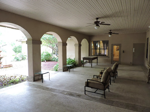 A spacious indoor area featuring elegant arches and comfortable seating.
