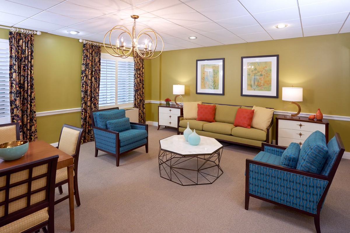 A cozy and stylish living room with colorful furniture and elegant decor.