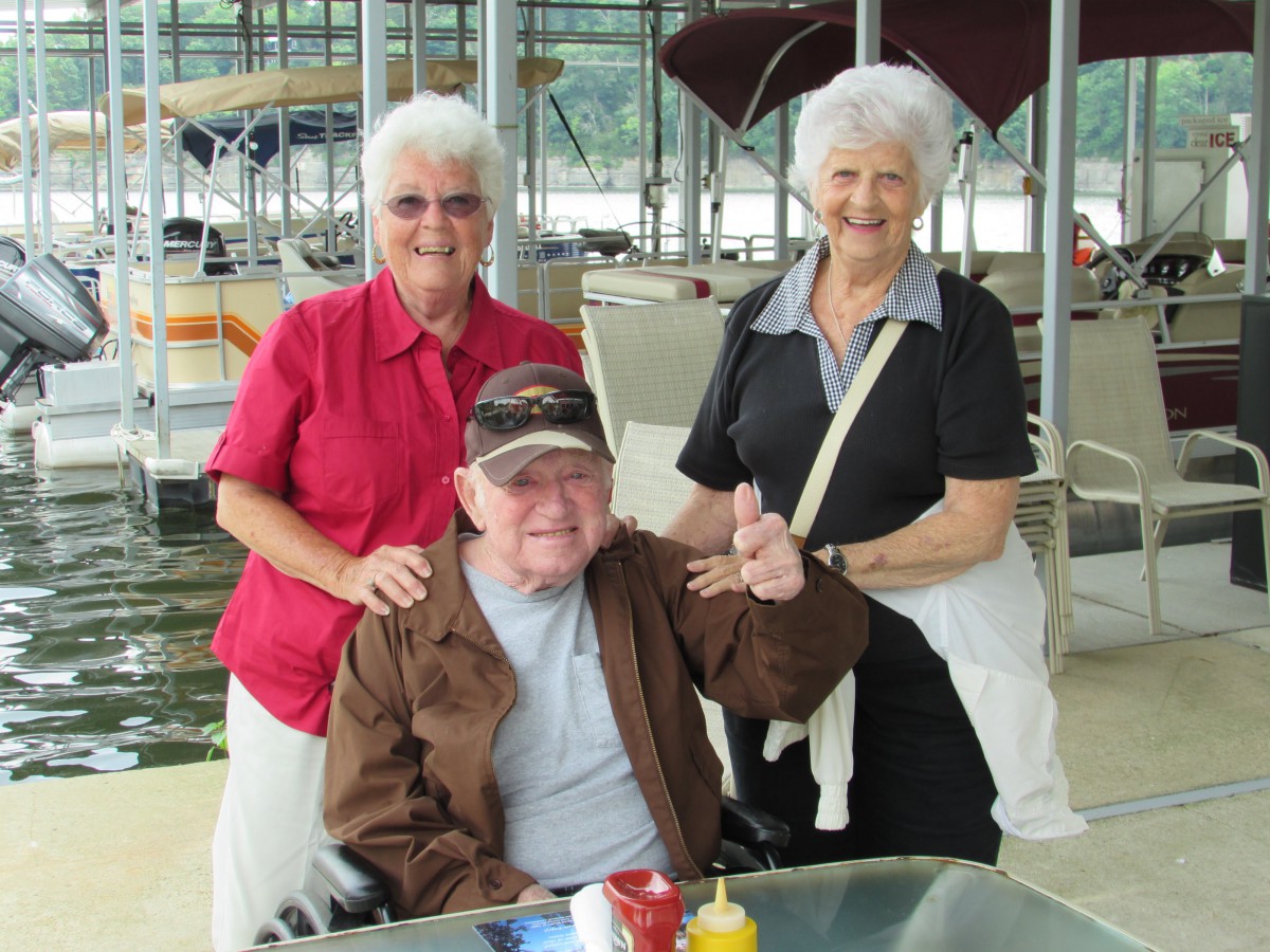 A group of three elderly individuals enjoying a day out together.