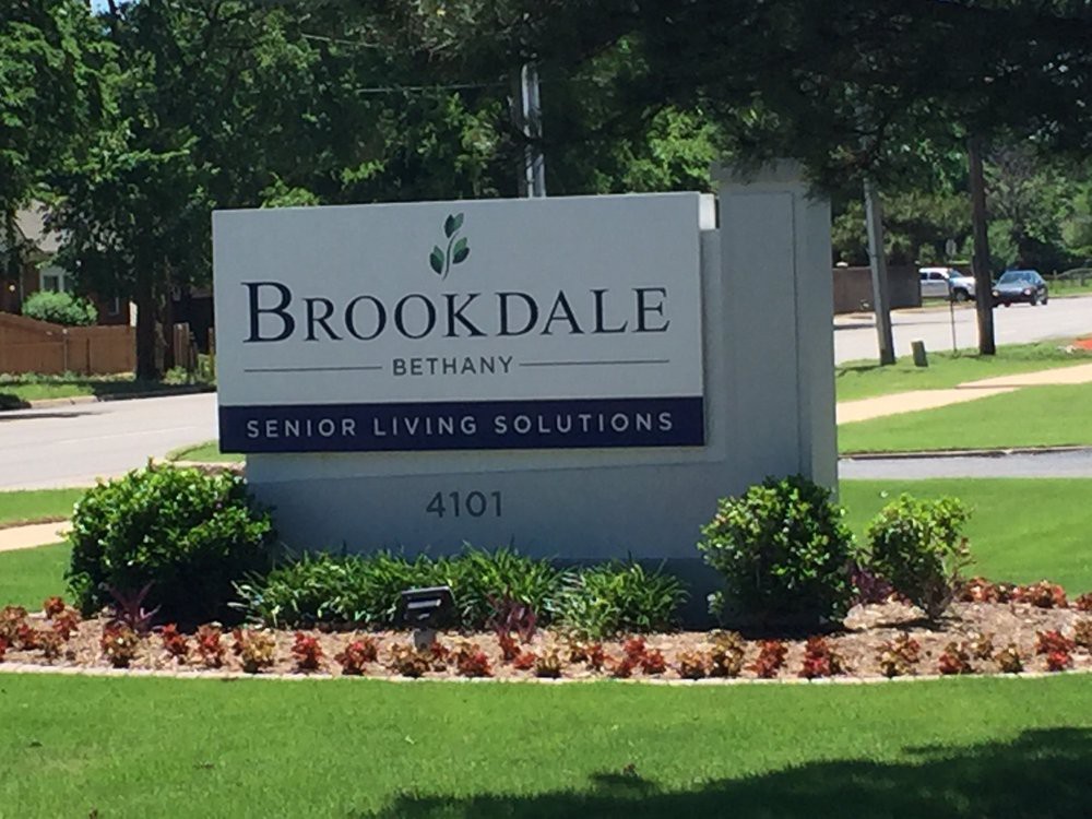 Sign for Brookdale Senior Living Solutions in a landscaped area.