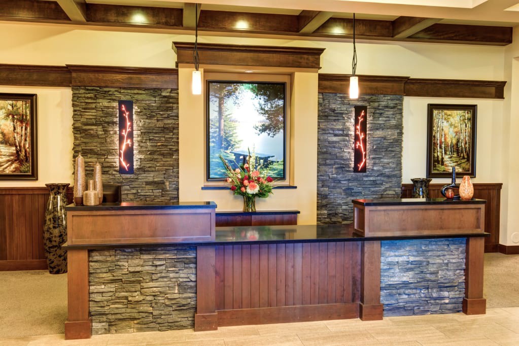 Elegant reception area with wood and stone design elements.