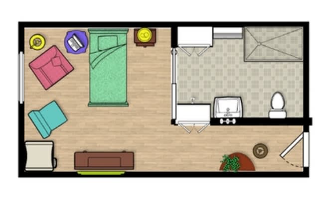 A simple floor plan showing a bedroom and an attached bathroom with furniture placement.