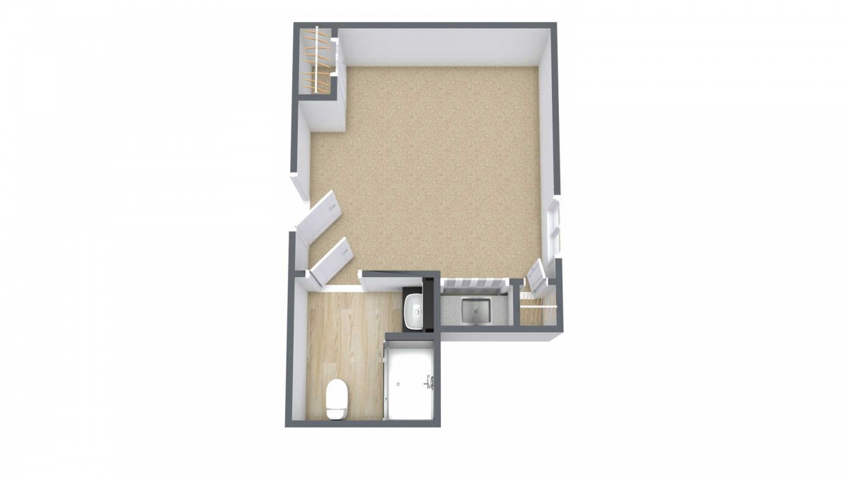 A floor plan of a compact studio apartment featuring an open living area, a small kitchen, and a bathroom.