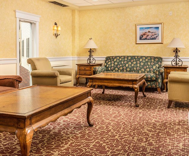 A cozy living room with classic furniture and warm lighting.