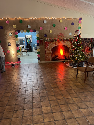 A cozy holiday setting featuring a decorated Christmas tree and festive decorations.