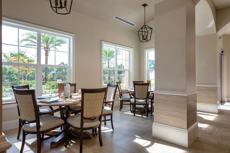 A bright and airy dining area with elegant seating and large windows.