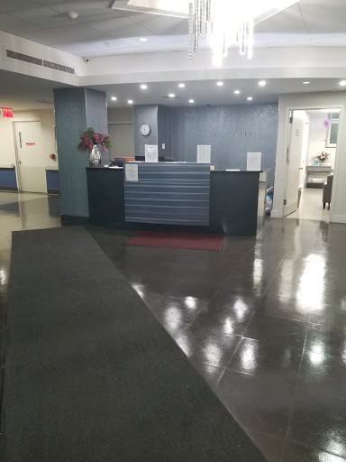 A modern reception area with polished floors and a sleek design.