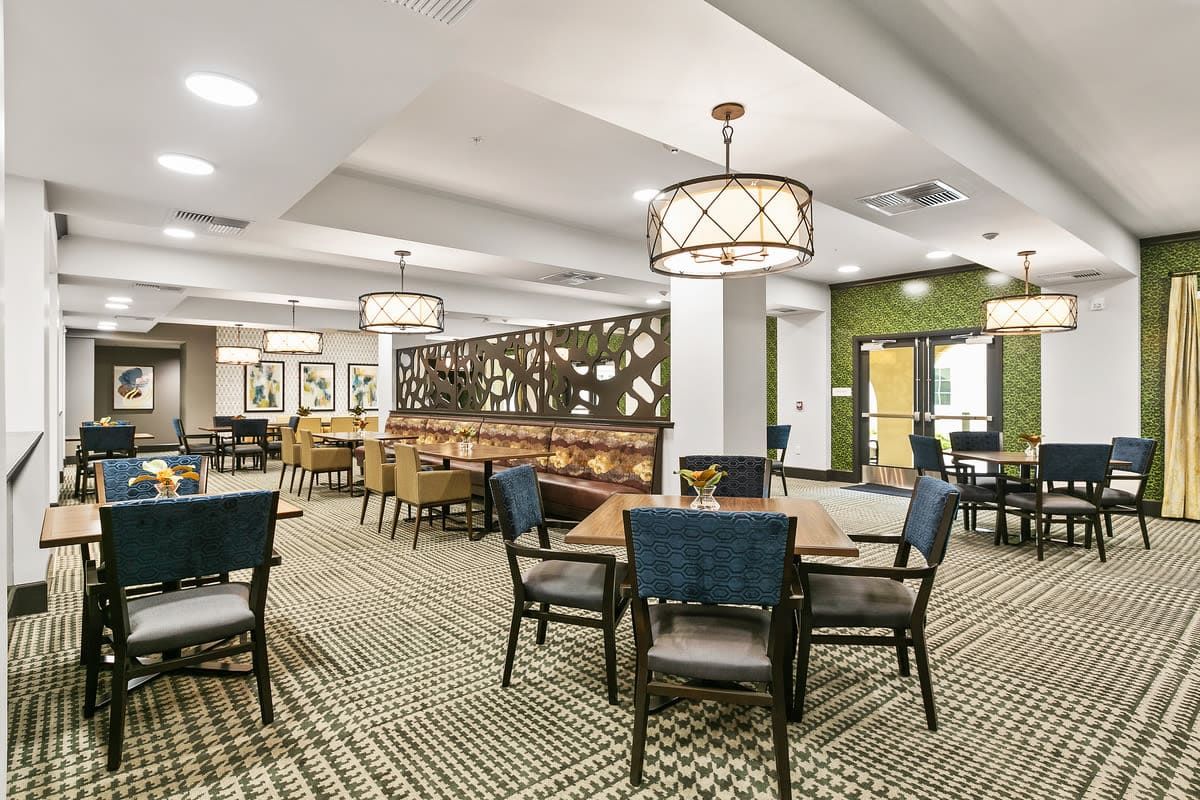 A modern dining area with stylish furniture and ambient lighting.