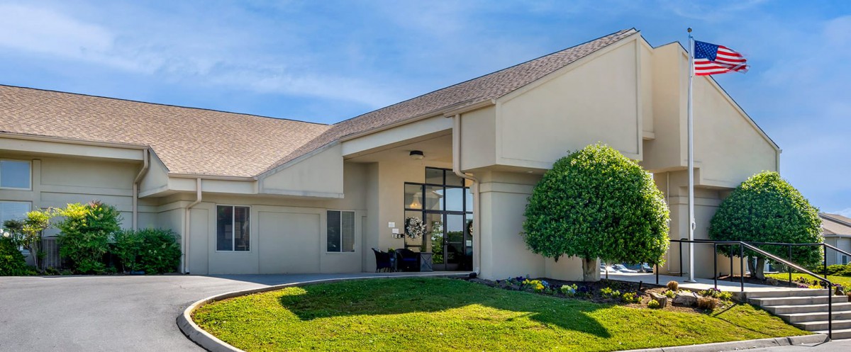 Modern residential house with a well-maintained lawn.
