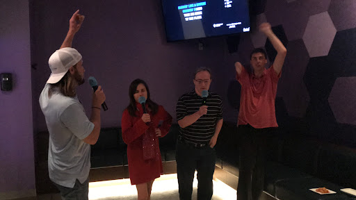 A fun night of karaoke with friends, sharing laughs and music.