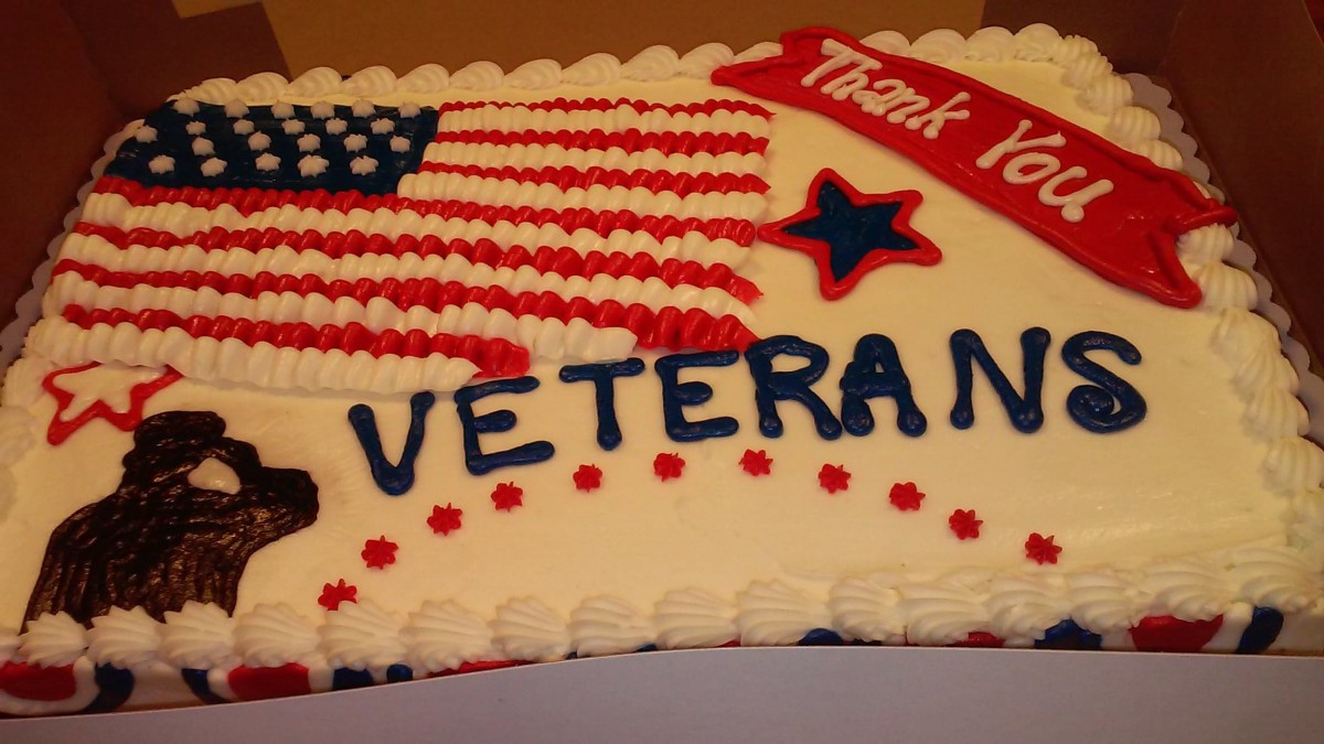 A cake decorated with an American flag design, thanking veterans.