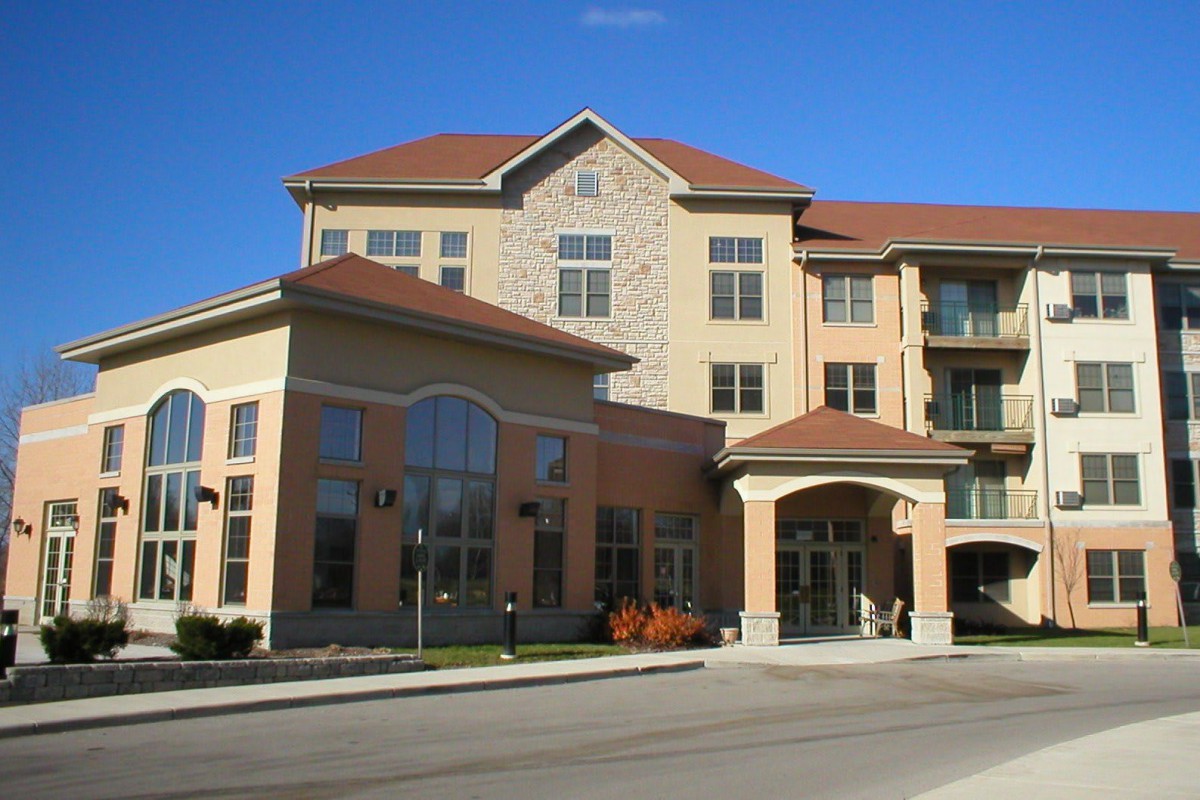 A multi-story residential building with modern architectural design.