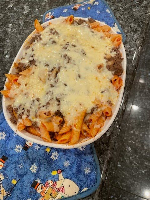 A delicious baked pasta dish topped with melted cheese.
