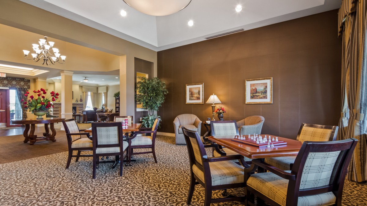 A cozy dining area with elegant furniture and warm lighting.