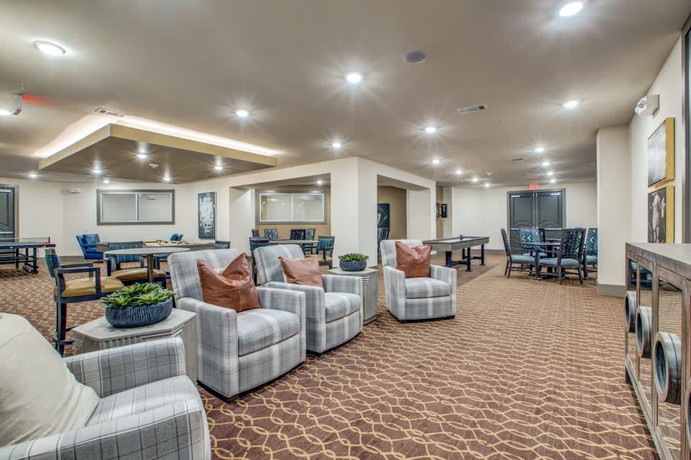 Modern lounge area with comfortable seating and warm lighting.