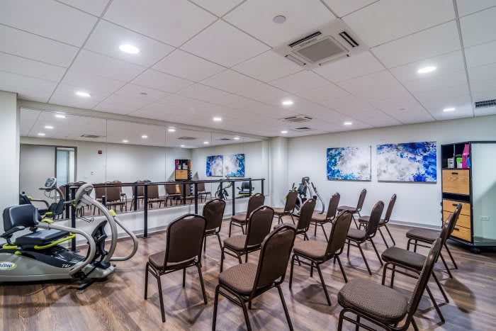 A conference room with arranged seating and presentation area.