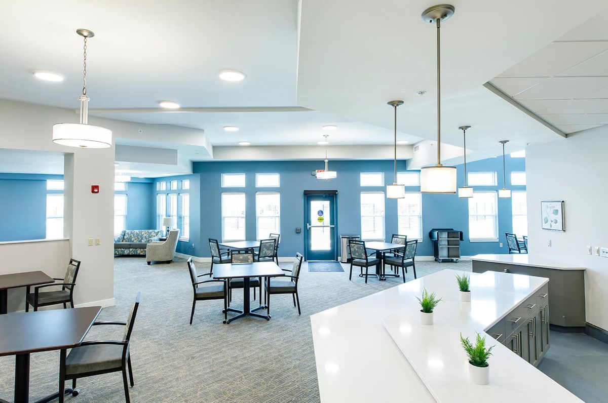 A modern and spacious lounge area with comfortable seating and stylish lighting.