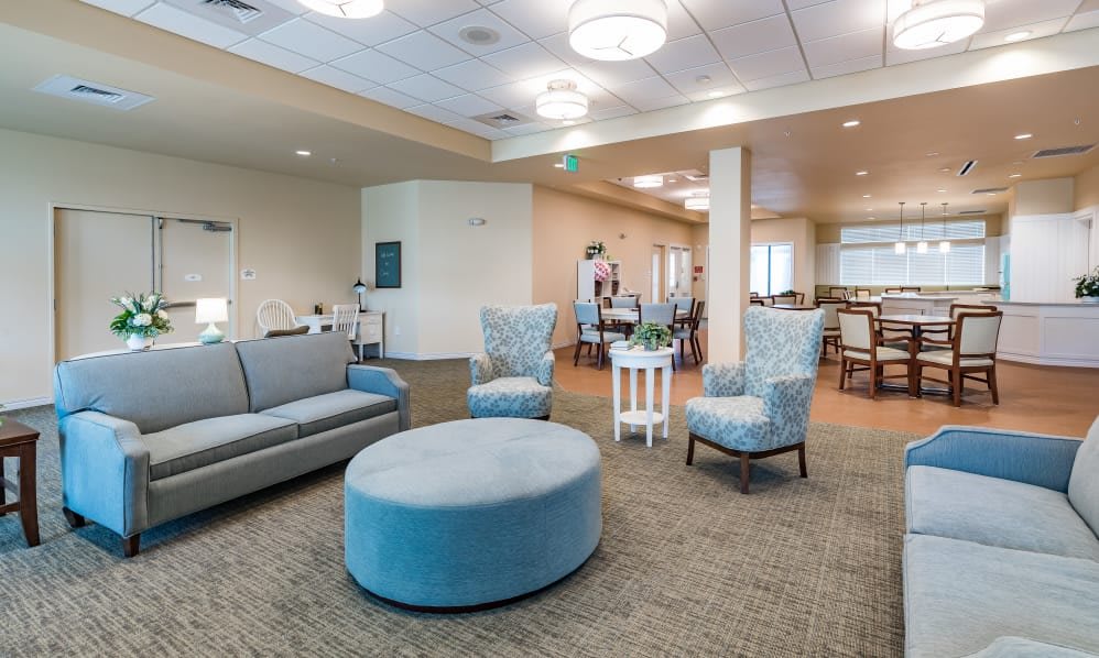 A modern living room with comfortable seating and soft lighting.