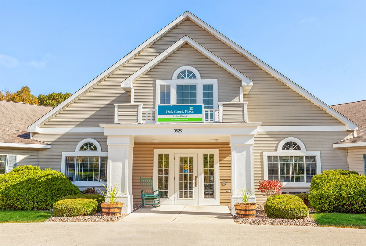 A welcoming front view of a professional office building under a clear blue sky.