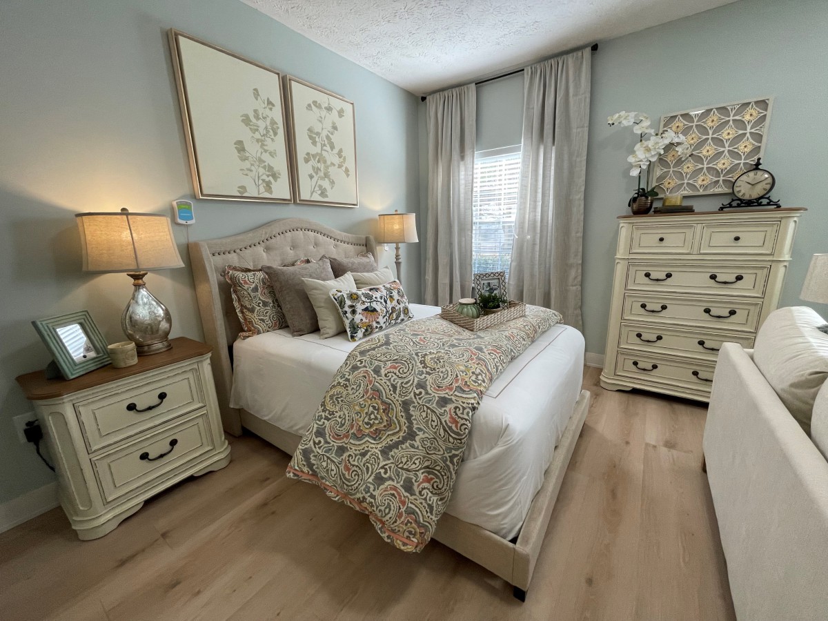 A cozy bedroom decorated with soft colors and elegant furniture.