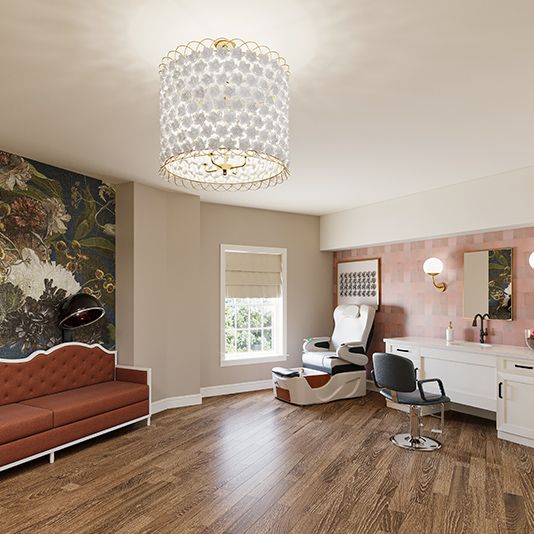 Modern salon interior with a stylish chandelier, hairdressing station, and wooden flooring.