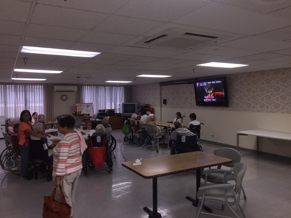 People gathered in a community center for an event.