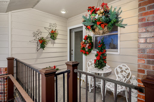 A beautifully decorated front porch ready for the holiday season.