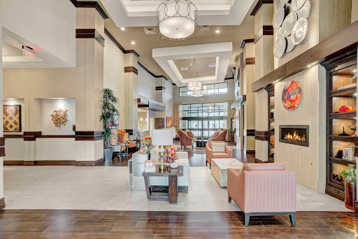 A stylish and modern hotel lobby featuring comfortable seating and elegant decor.