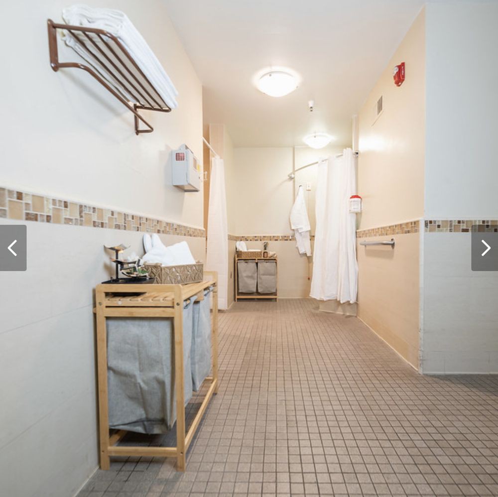 A modern bathroom with tiled flooring and stylish fixtures.
