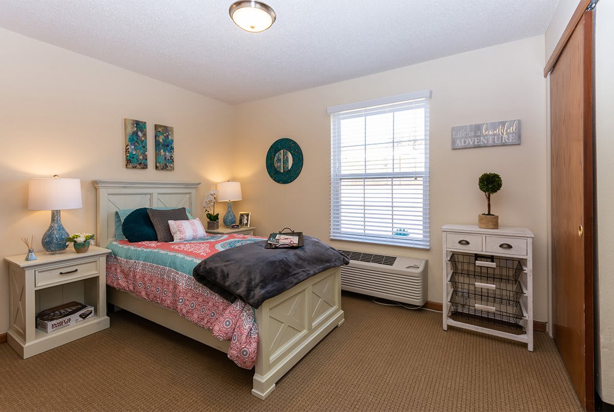 A cozy bedroom with soft lighting and tasteful decor.