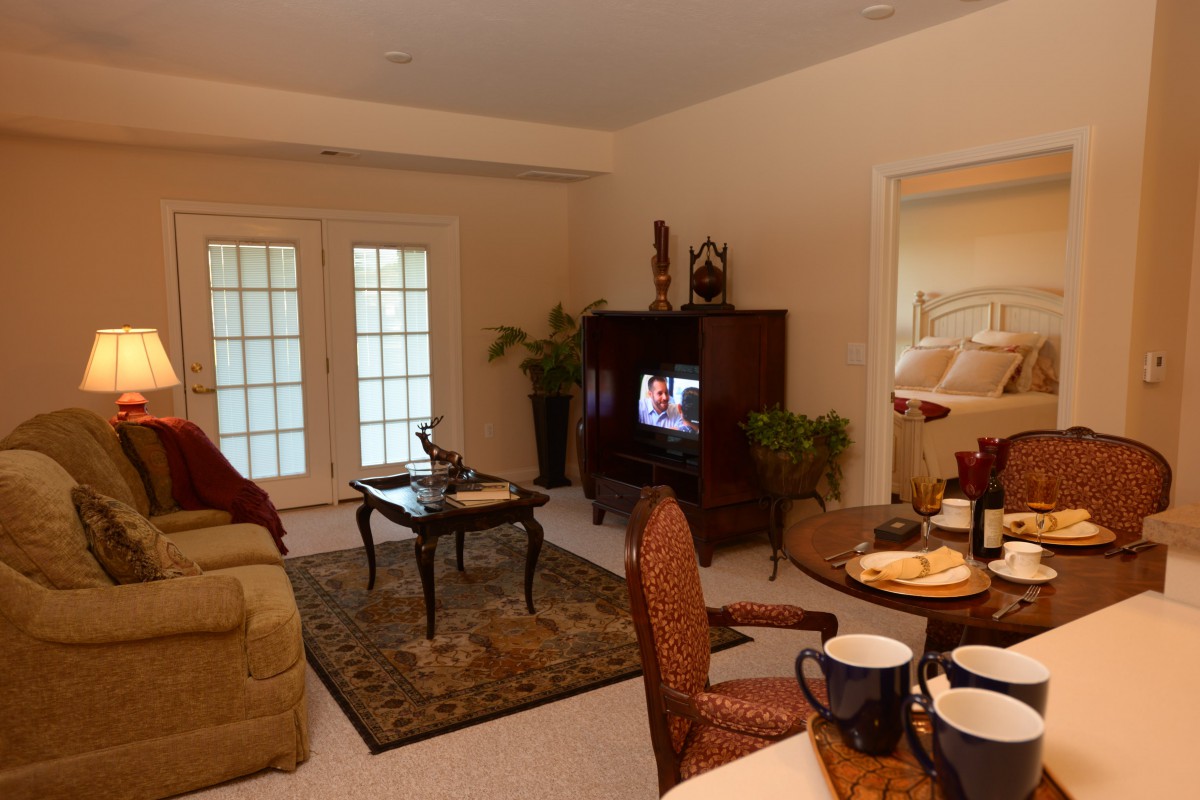 Cozy living room with comfortable seating, a television, and decorative accents.