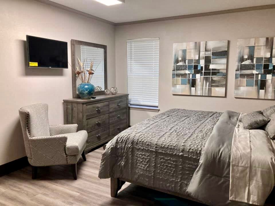 A modern bedroom with stylish decor and comfortable furniture.