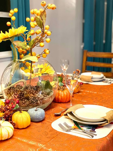 A beautifully decorated autumn dinner table ready for a festive gathering.