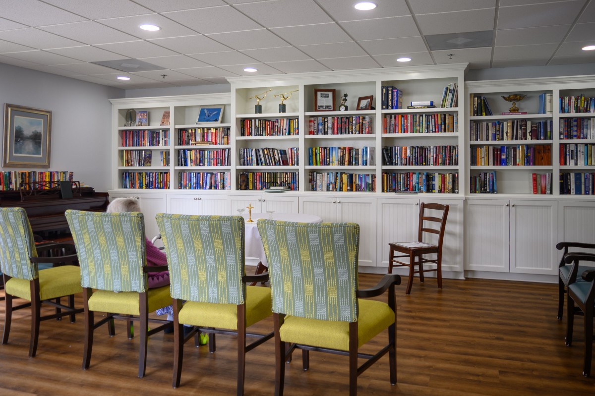 A cozy reading area with bookshelves and comfortable chairs.
