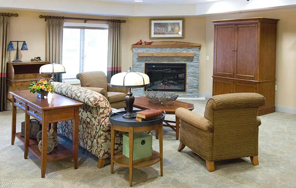 A cozy living room with comfortable seating and a fireplace.