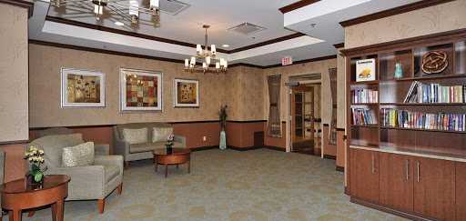 A cozy lobby area featuring comfortable seating, decorative artwork, and a welcoming ambiance.