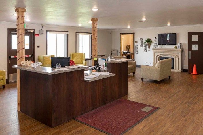 A welcoming reception area with modern furnishings and a central desk.
