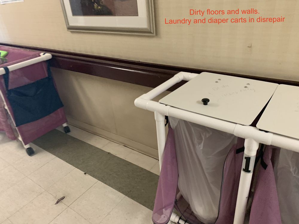 Hospital hallway with a laundry cart designated for dirty linens.