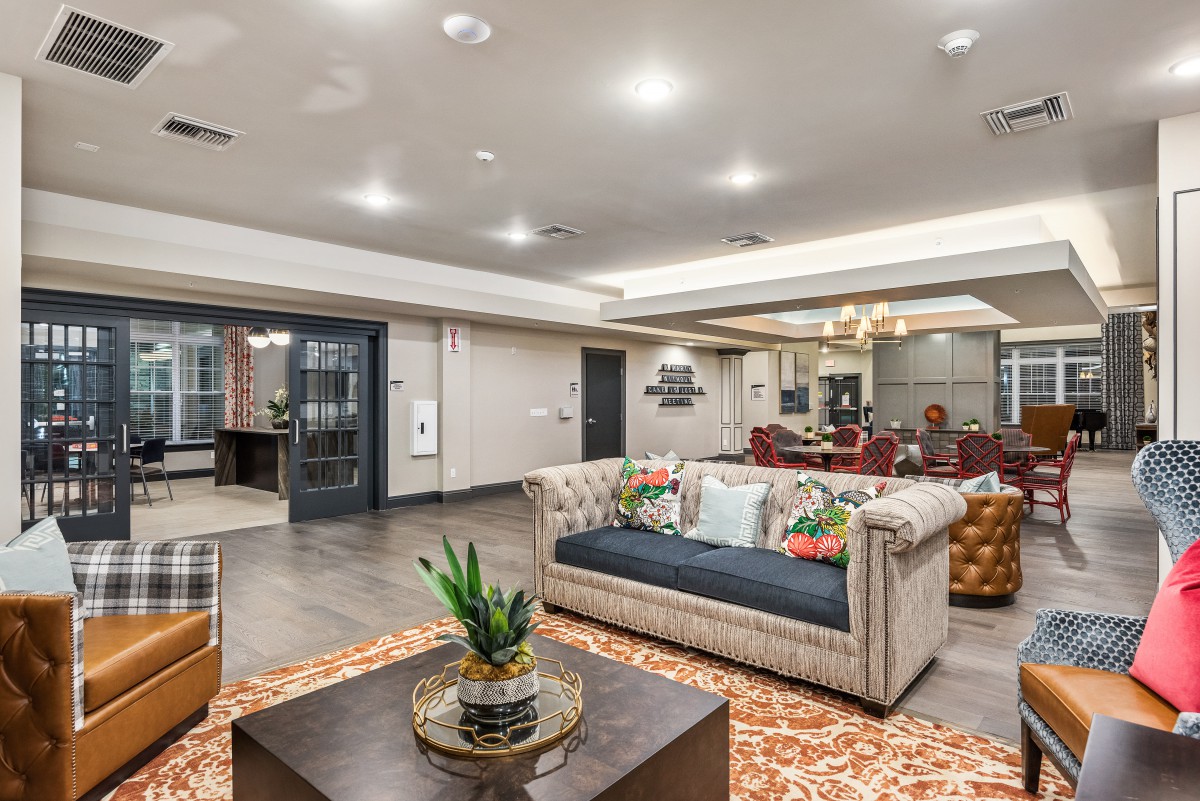 A stylish and modern living room with comfortable seating and elegant decor.
