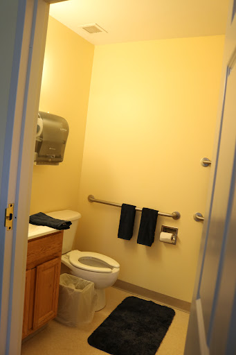 A clean and simple bathroom featuring essential amenities.