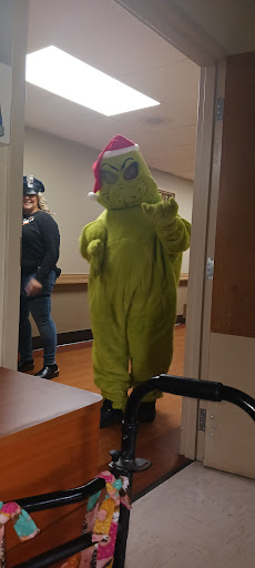 The Grinch makes an appearance to spread some holiday cheer!