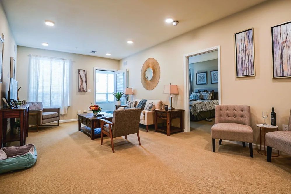 A modern living room with stylish furniture and neutral decor.