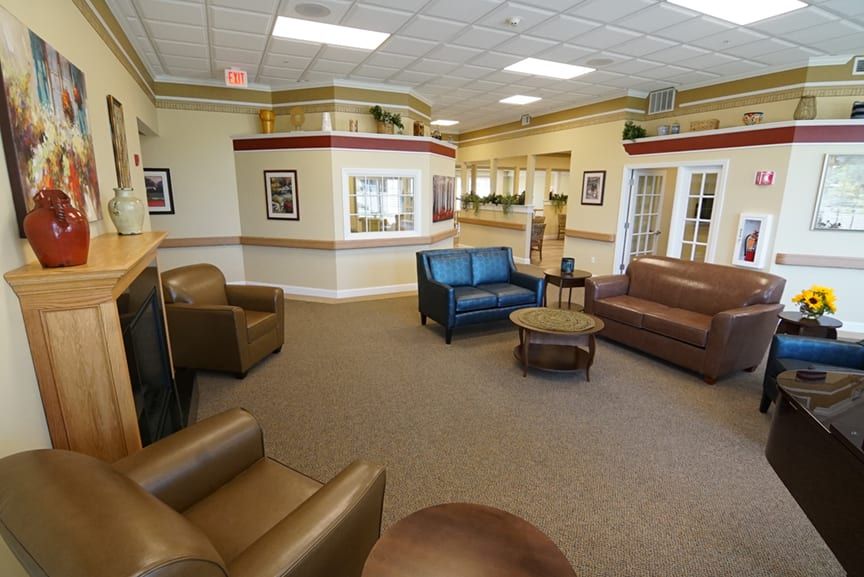 A spacious and well-furnished lobby area with sofas and armchairs.