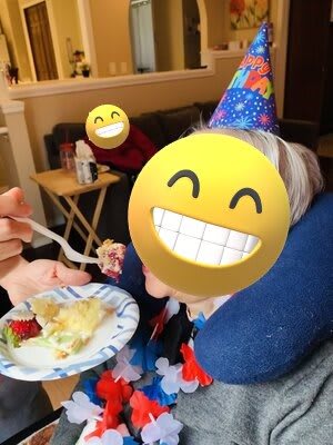 A festive birthday celebration with cake and smiles.
