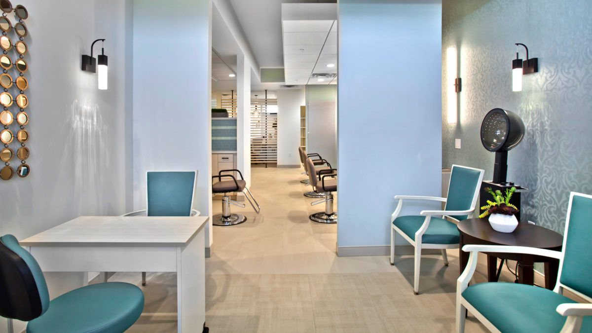 Modern office interior with seating and workspace areas.
