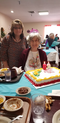 A joyful birthday celebration with cake and candles.