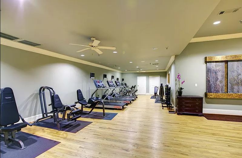 A well-equipped indoor gym featuring treadmills and exercise machines.