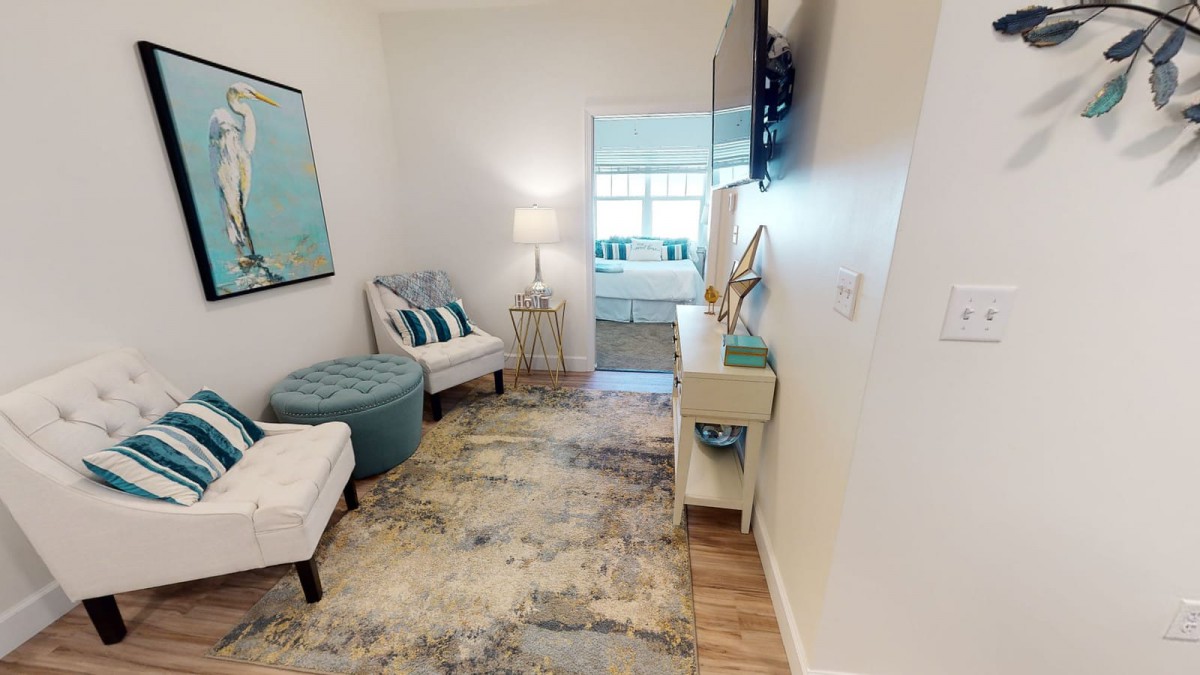 A cozy modern living room with stylish decor, featuring comfortable seating and soft lighting.