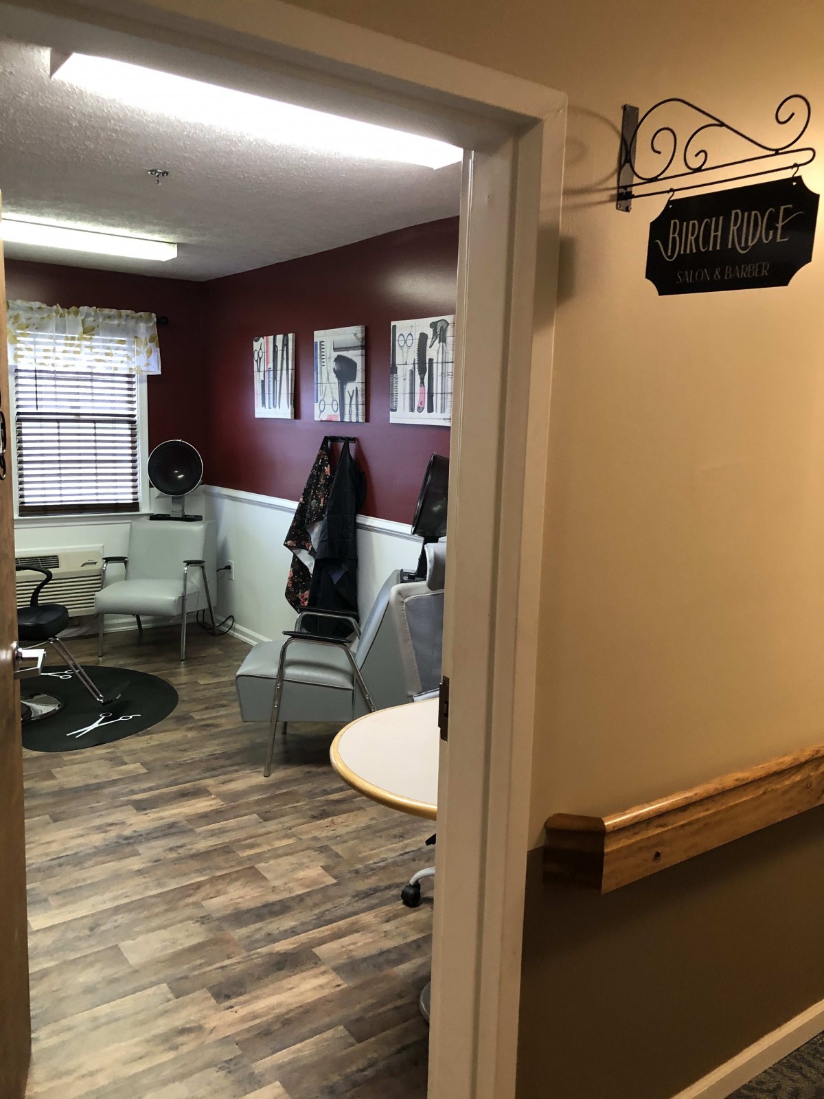 A cozy hair salon with chairs and mirrors, ready for customers.