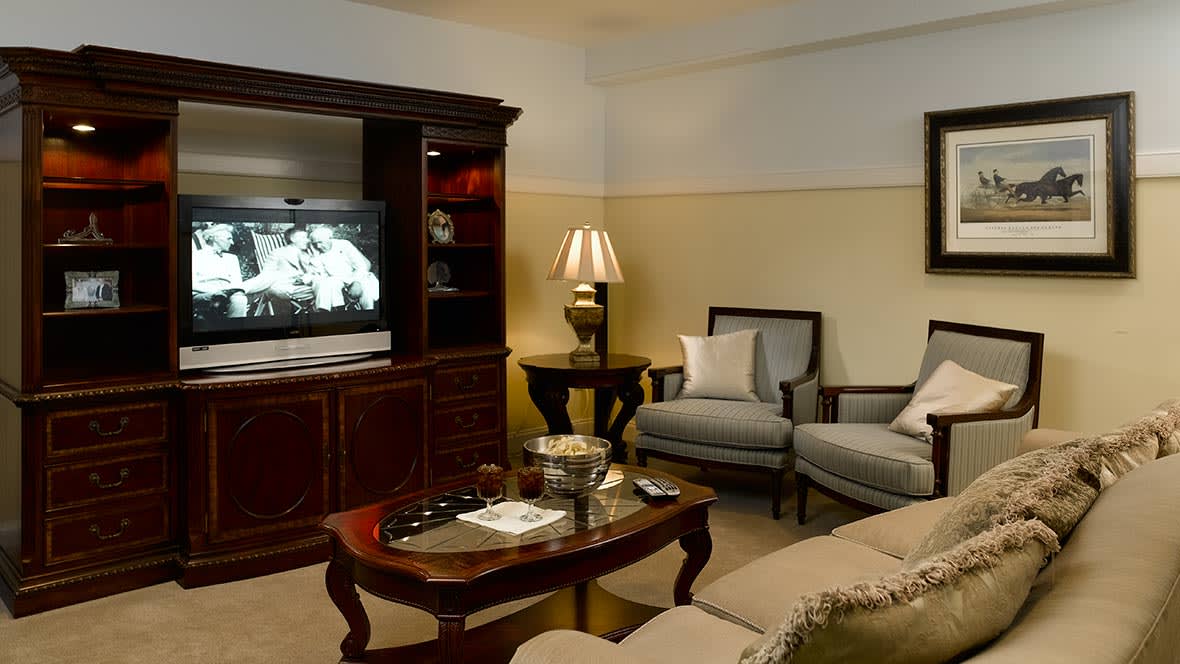 A cozy living room with comfortable seating and a television.